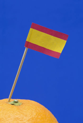 Close-up of flag against clear blue sky