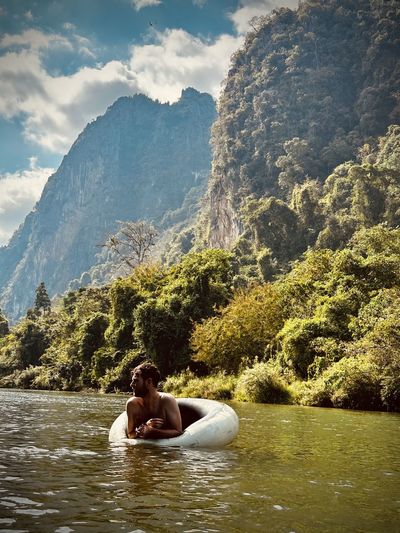 Tubing and floating down river in laos 