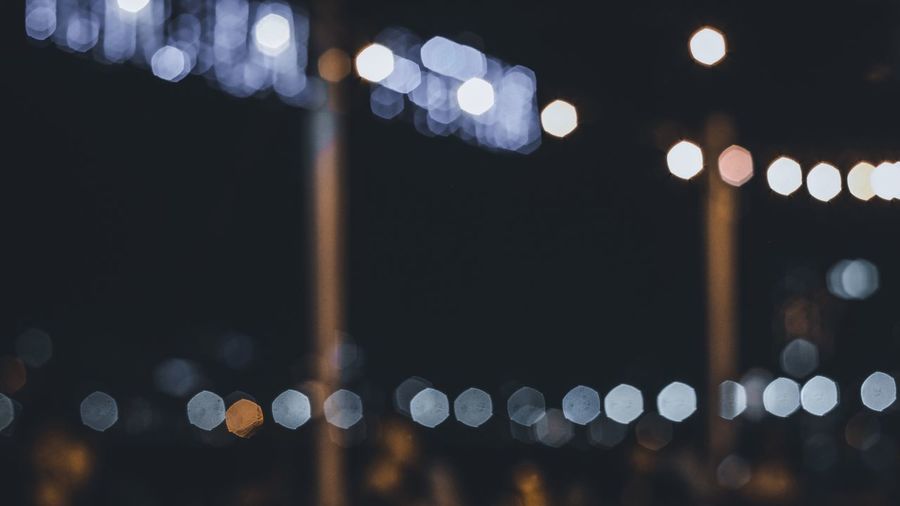 Defocused image of illuminated lights at night