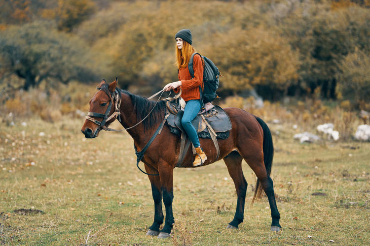 Man riding horse on field