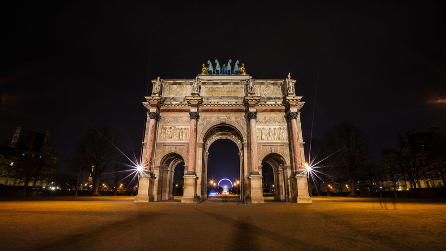 Low angle view of historical building at night