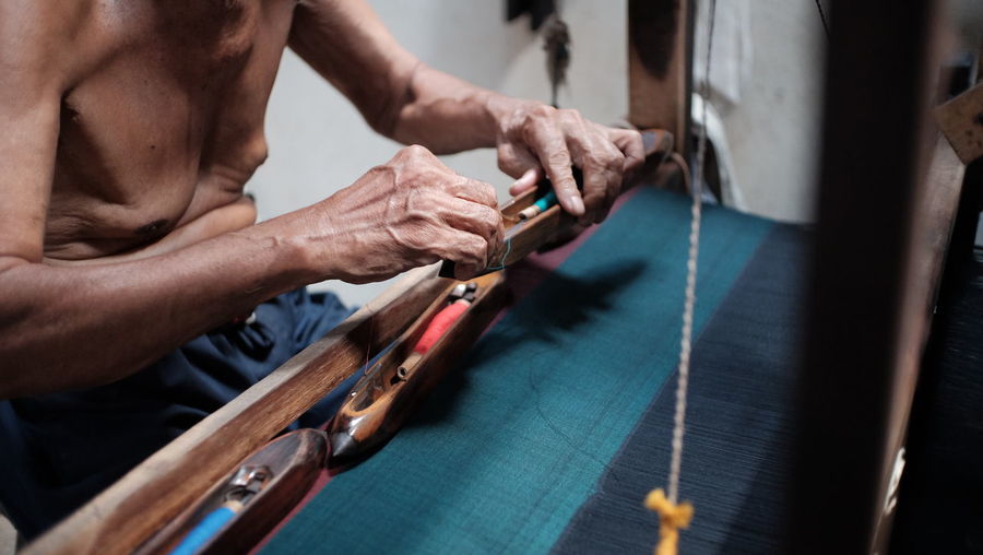 Midsection of man working