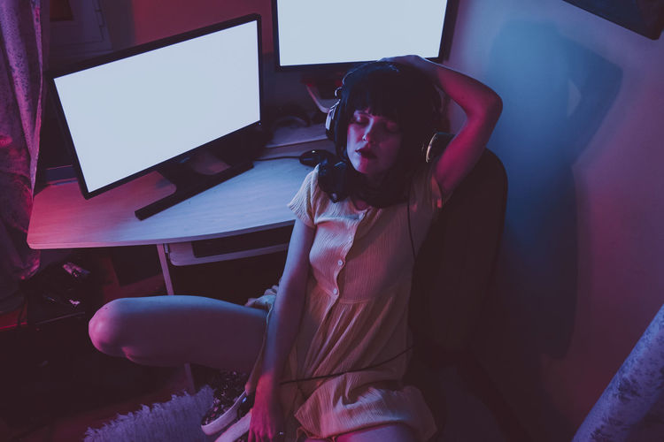 Portrait of young woman looking at home