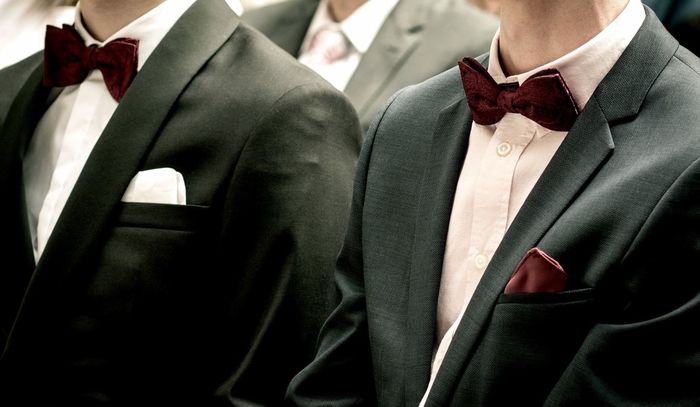 Midsection of men in suit during wedding