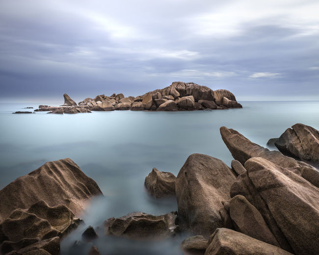 Amazing fine art long exposure image of rock formation resembling a sleeping giant. 