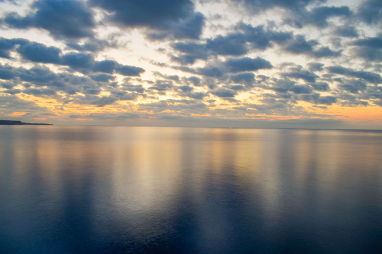 Scenic view of sea against sky during sunrise