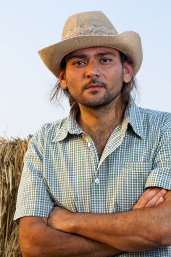 Portrait of man wearing hat in farm
