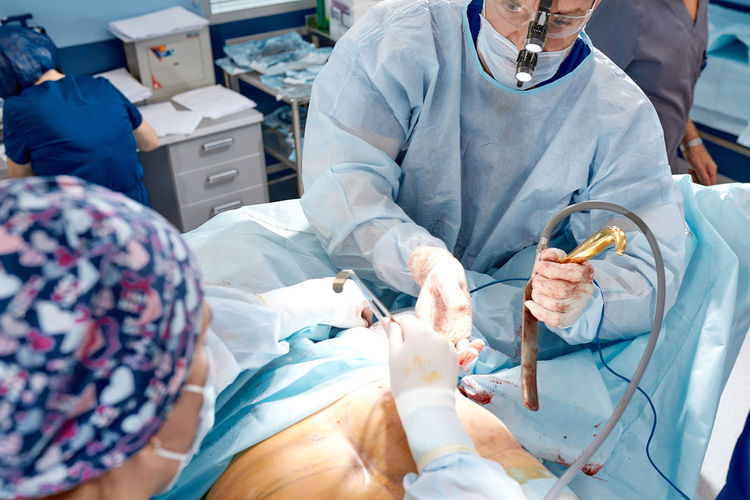 High angle view of dentist examining patient at clinic