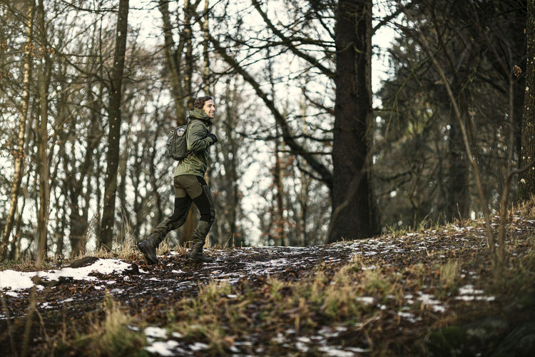 Man walking through forest