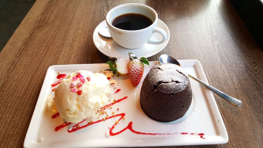 High angle view of coffee served on table