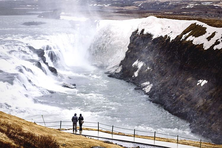 High angle view of people looking at gullfoss falls