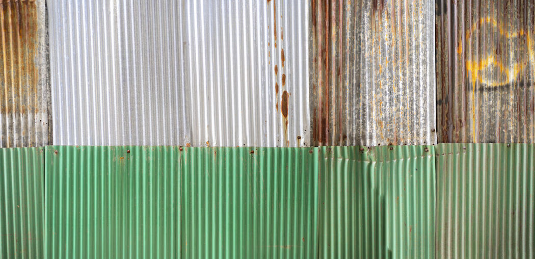 Old rusty zinc sheet wall, rusty zinc barn wall. panorama zinc wall pattern texture background