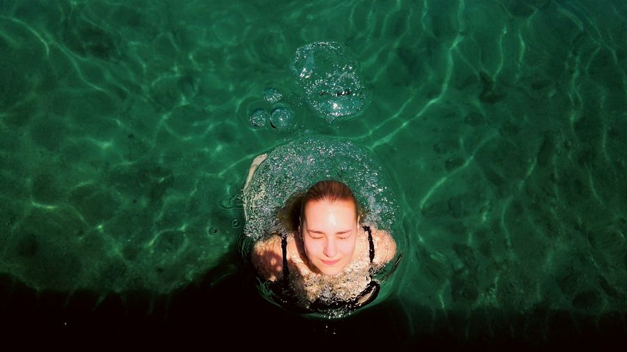 High angle view of woman swimming