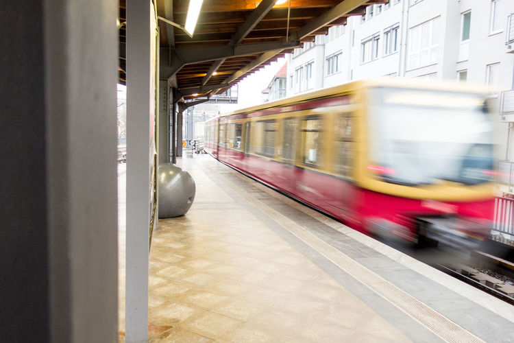 Blurred motion of train arriving at station