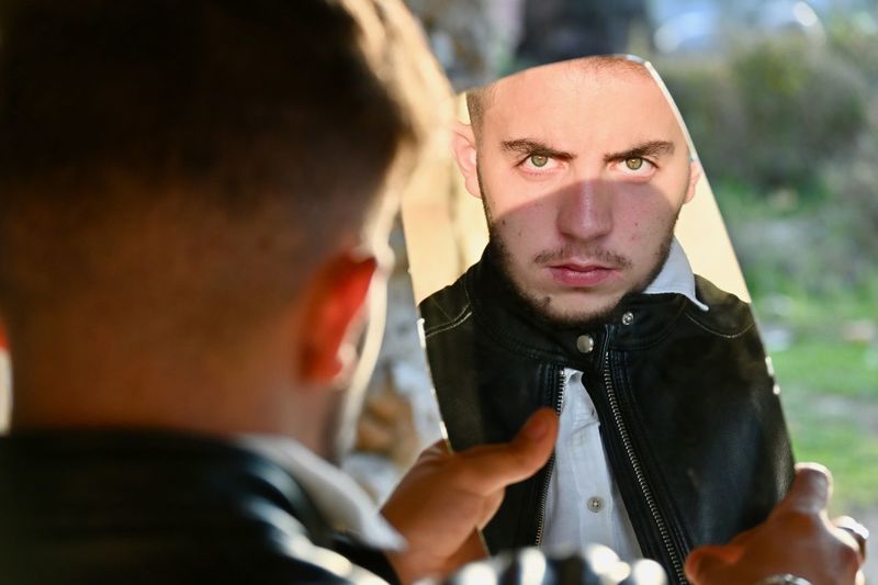Portrait of young man looking away