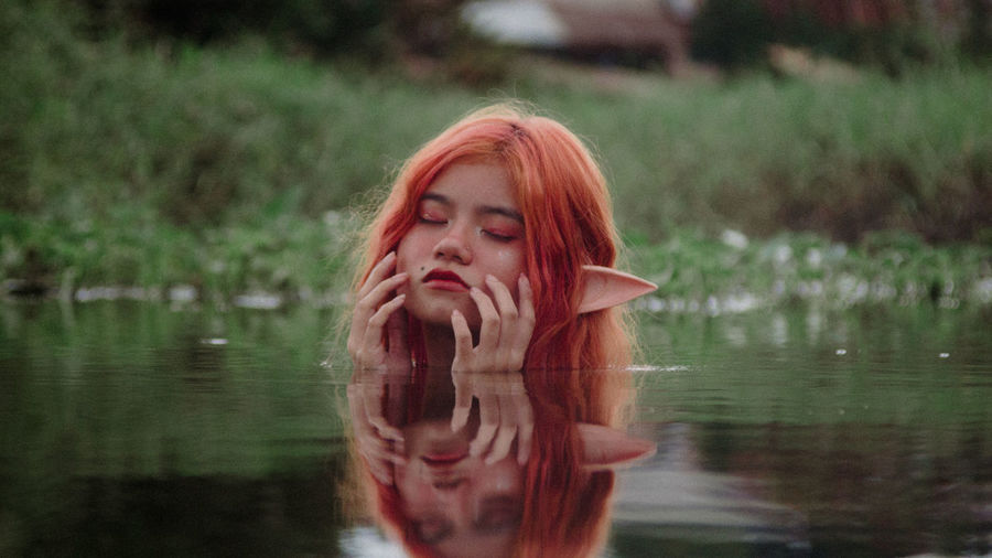 Young woman in lake