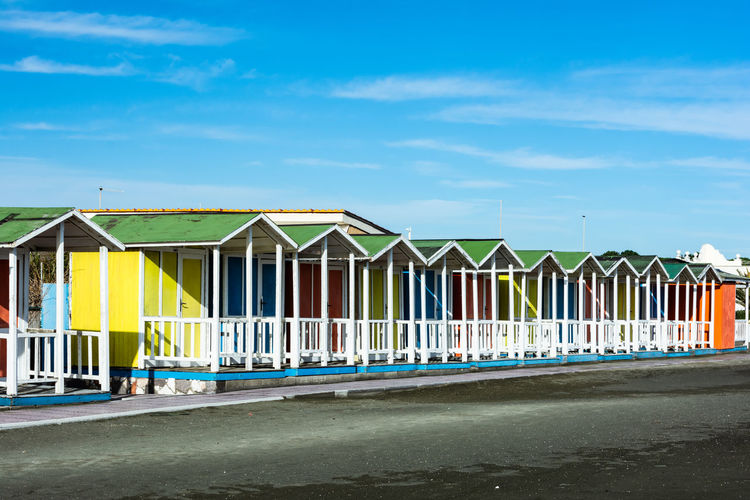 Beach huts against blue sky
