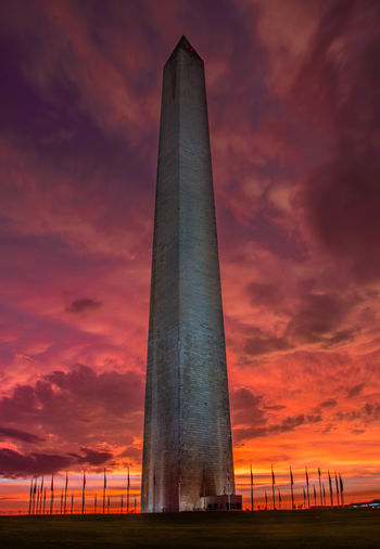 Low angle view of washington monument against cloudy sky at sunset