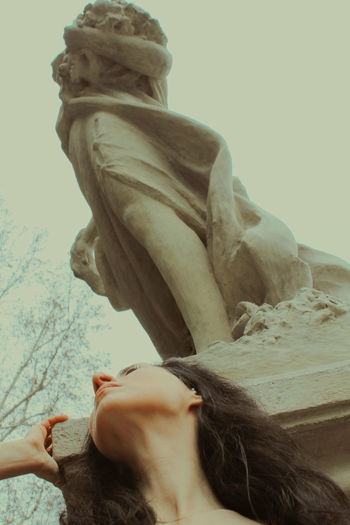 Low angle view of woman against sky
