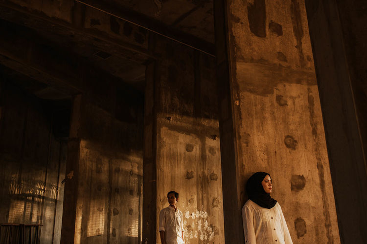 Low angle view of people standing outside building