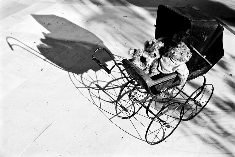 High angle view of baby carriage with toys