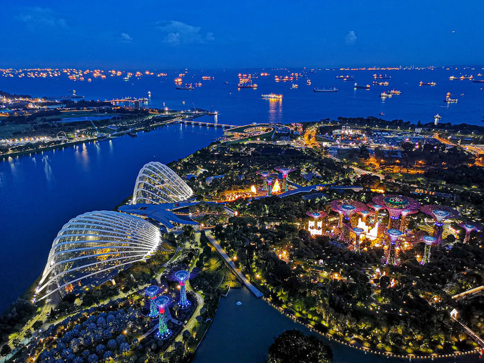 High angle view of gardens by the bay in city at night