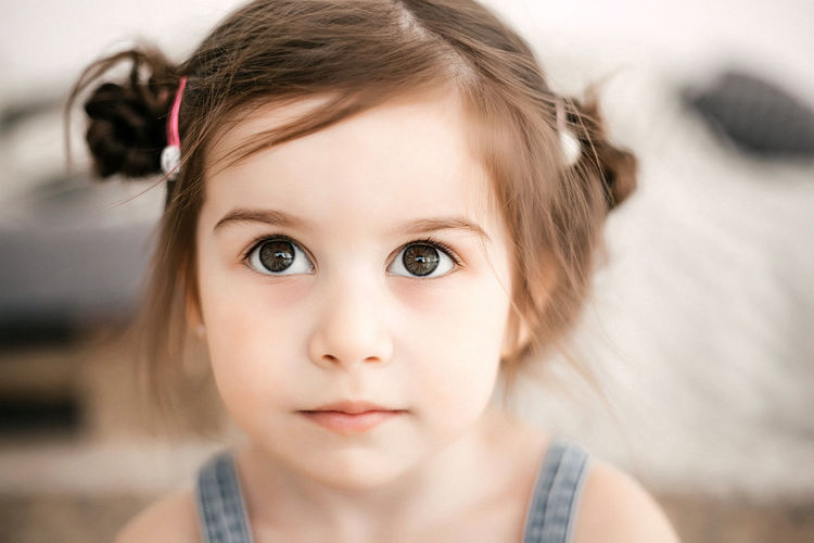 Portrait of a funny little girl with beautiful eyes and a smile.