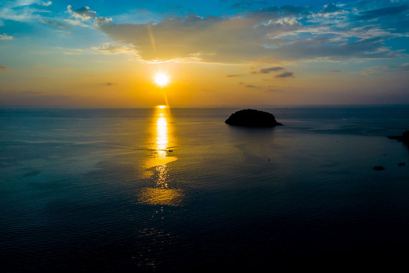 Tourism watching beautiful sea with sunset scene. aerial view