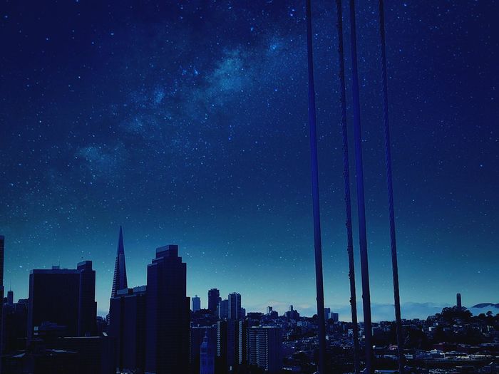 Skyscrapers against sky at night