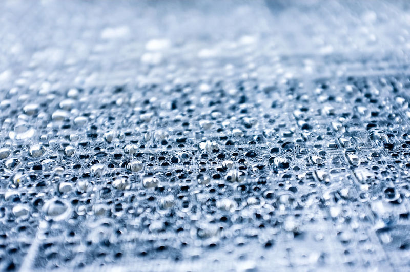 Full frame shot of rain drops on plastic membrane