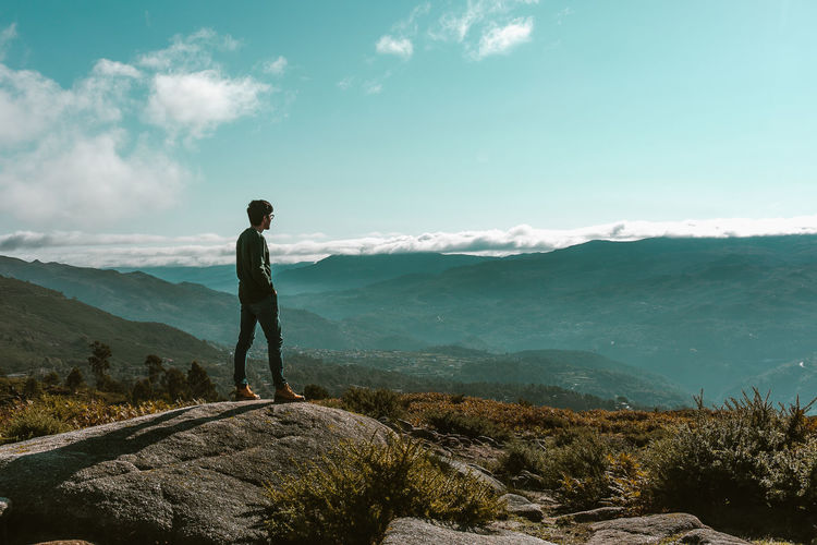 Full length of man standing on cliff