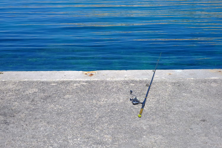 High angle view of fishing rod at sea