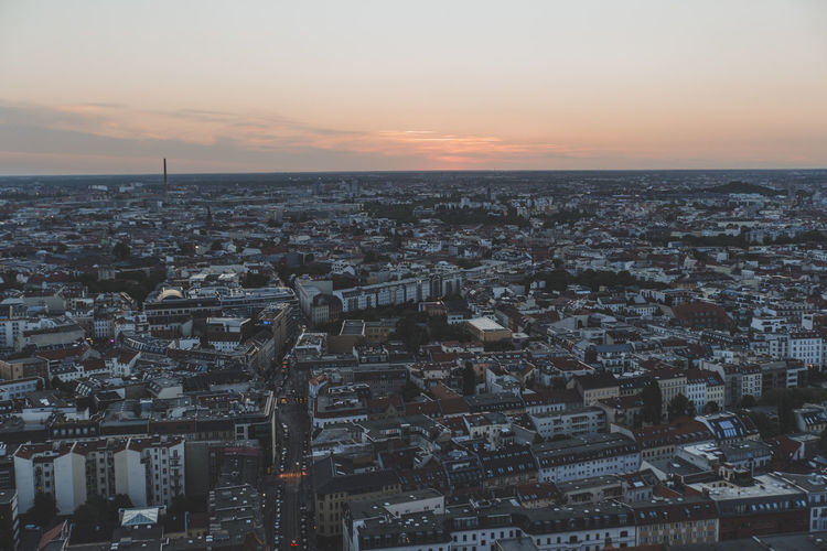 High angle view of city at sunset