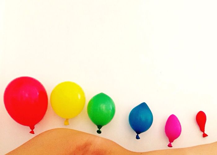 Colorful balloons over white background