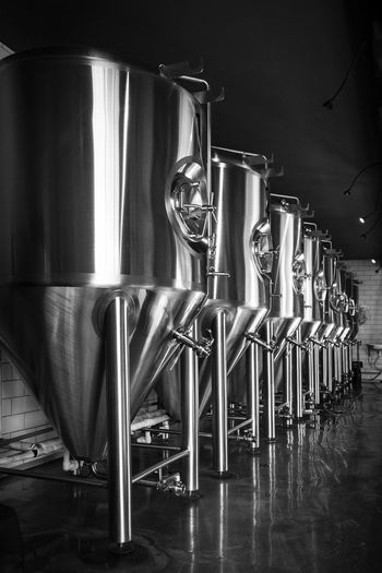 Stainless steel containers arranged in industry