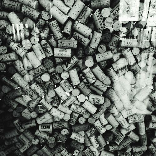 Full frame shot of wine corks seen through glass