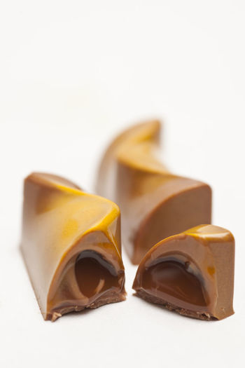 Close-up of chocolate over white background