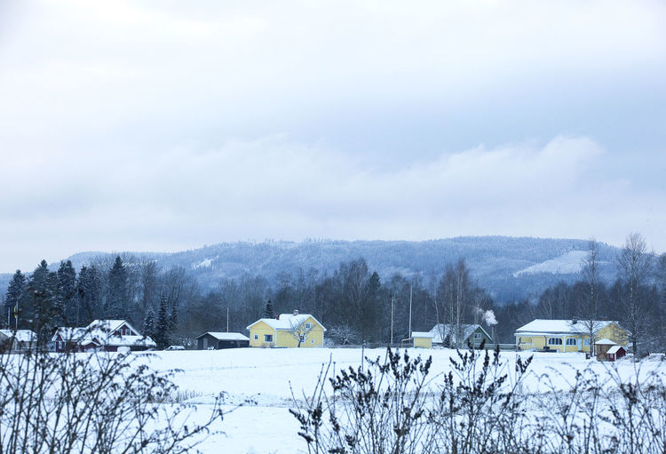 Scenic view of snow covered mountains against sky