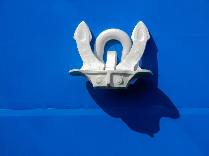 Close-up of white key on blue table