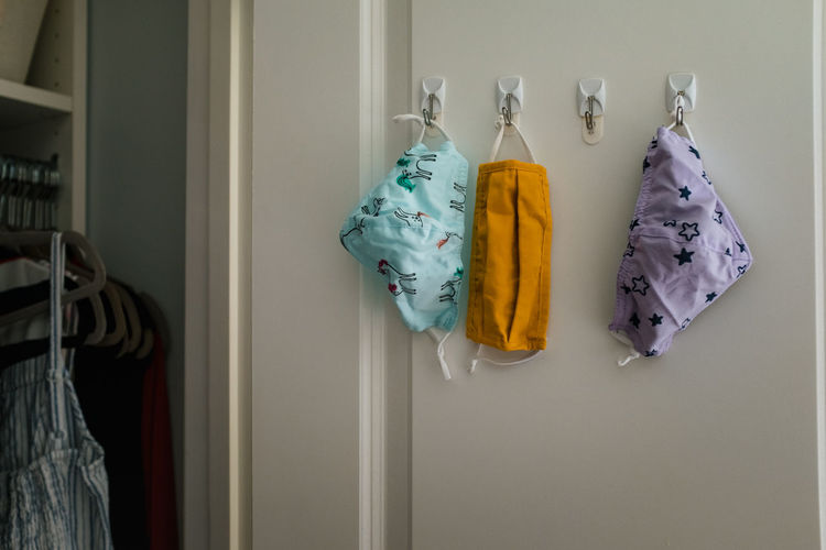 Clothes drying against white wall at home