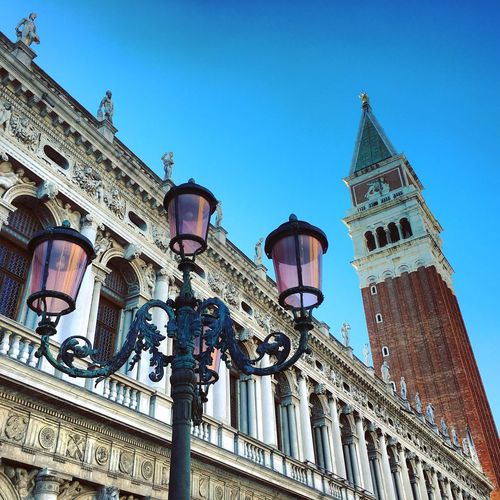 Low angle view of street light against st mark campanile