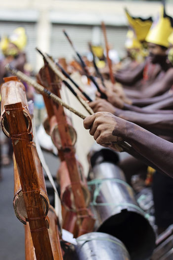 Cropped image of traditional musicians performing on street