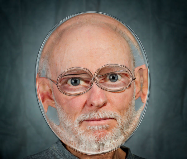 Distorted image of man against gray background