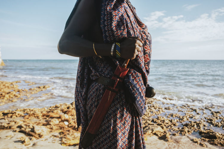 Close up of maasai warrior with a traditional knife attached to a belt