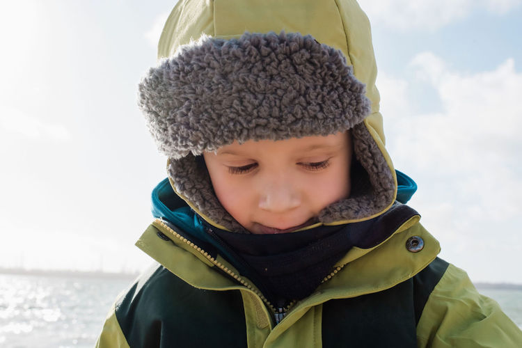 Close-up portrait of boy in snow