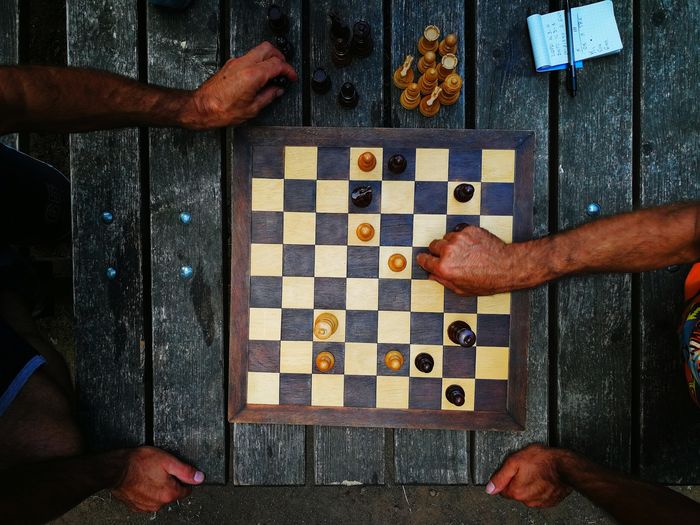 High angle view of men playing on table