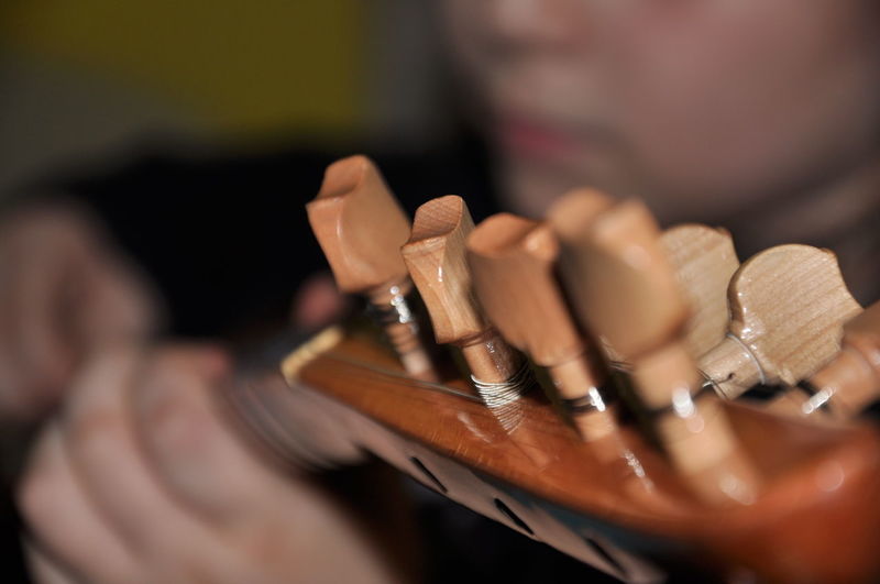 Close-up of child holding guitar 