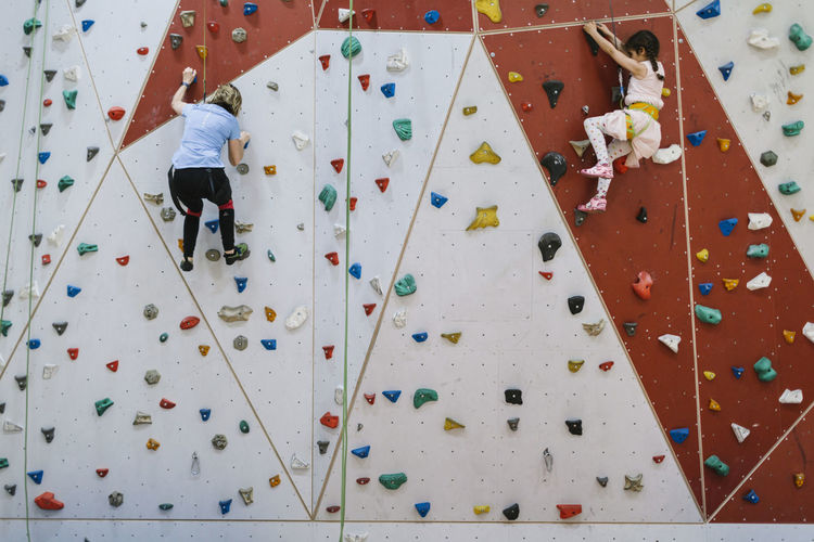 Mother with daughter on climbing gym