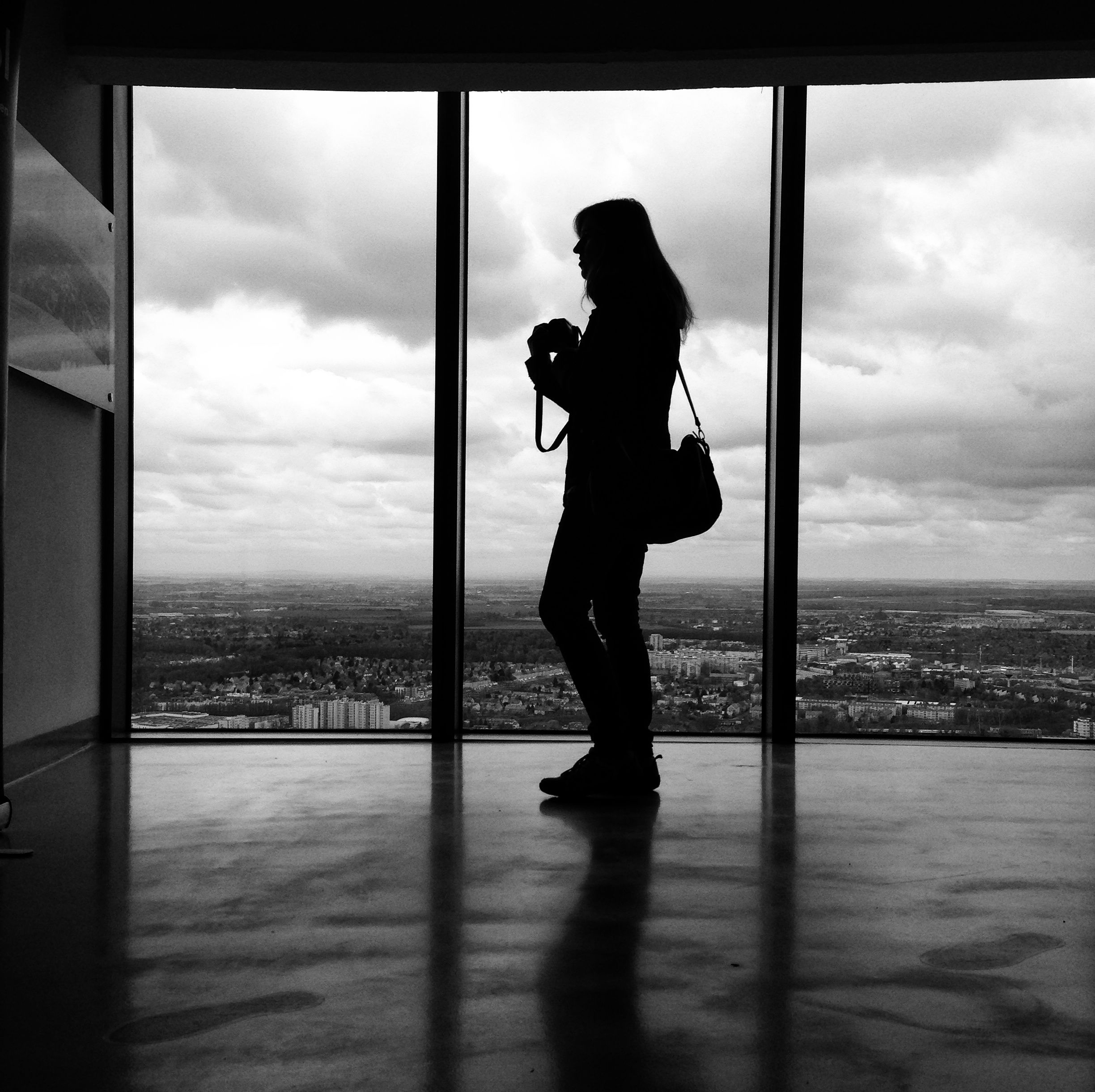window, cloud - sky, sky, one person, full length, real people, looking through window, indoors, silhouette, women, side view, standing, day, lifestyles, water, nature, young adult, sea, young women, cityscape, architecture, adult, people