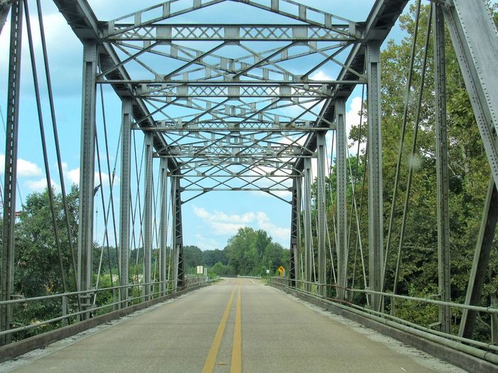 Old iron bridge on rural road in mississippi 
